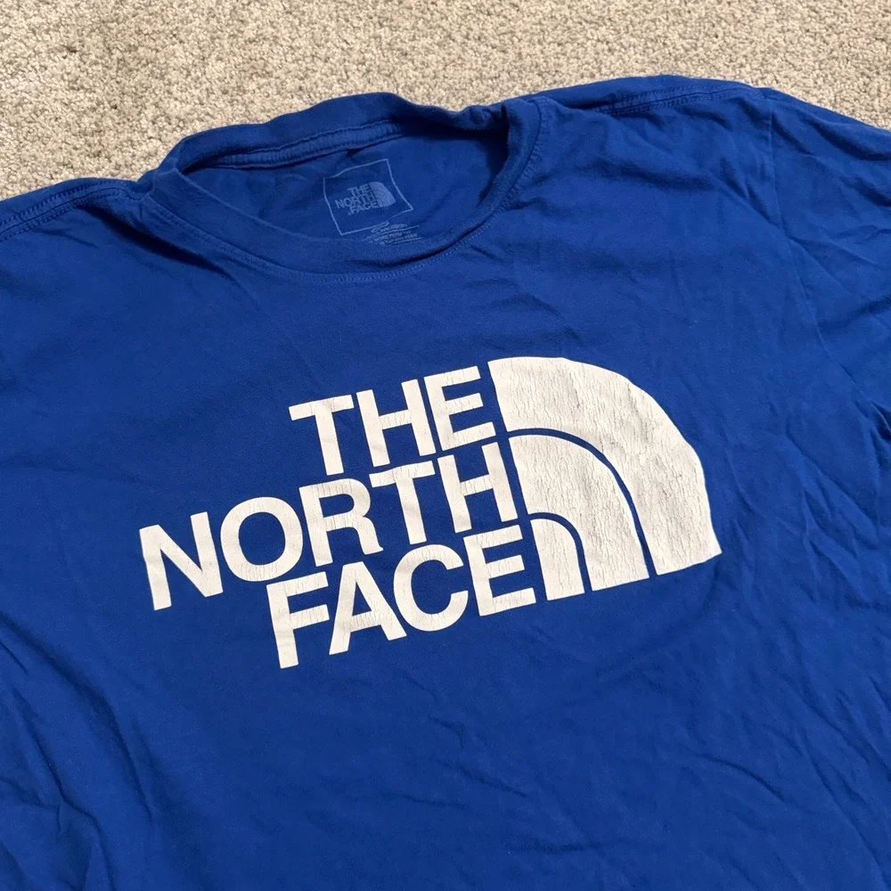 The North Face Mens Royal Blue Graphic Logo T-Shirt Size Large Circular Design